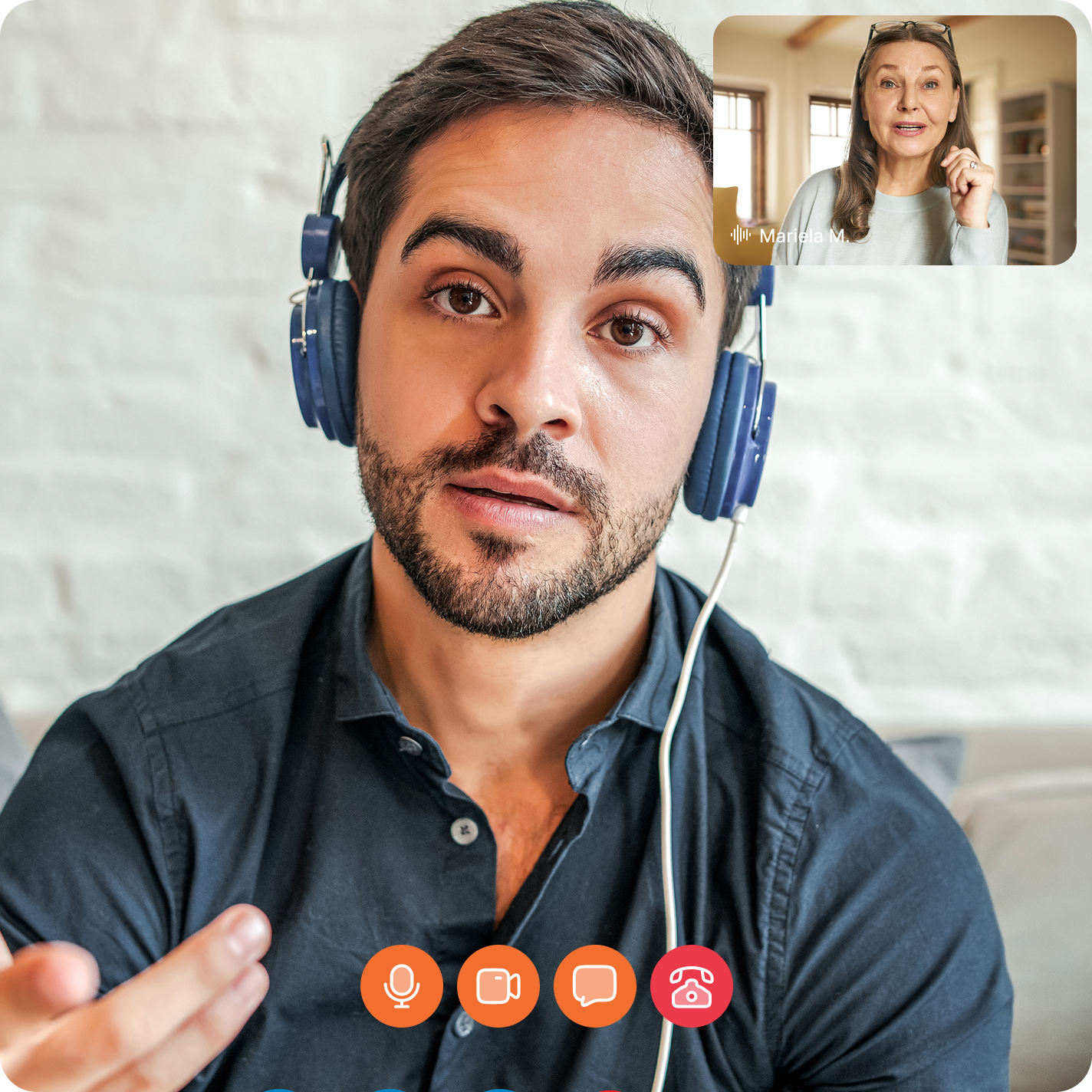 Video call between a young man wearing headphones and a woman in a small inset window labeled 'Mariela M.' with call control icons visible at the bottom.