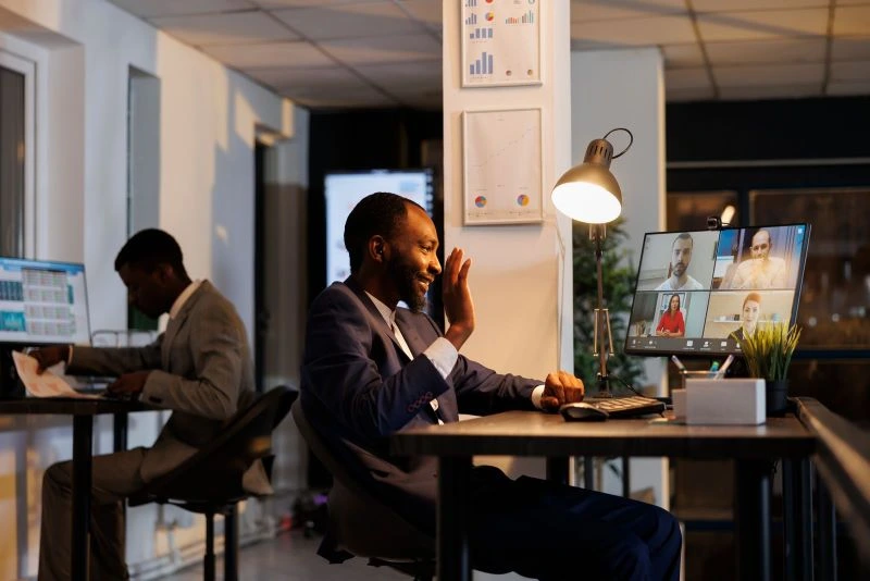 Remote team members collaborating via video conferencing from different locations